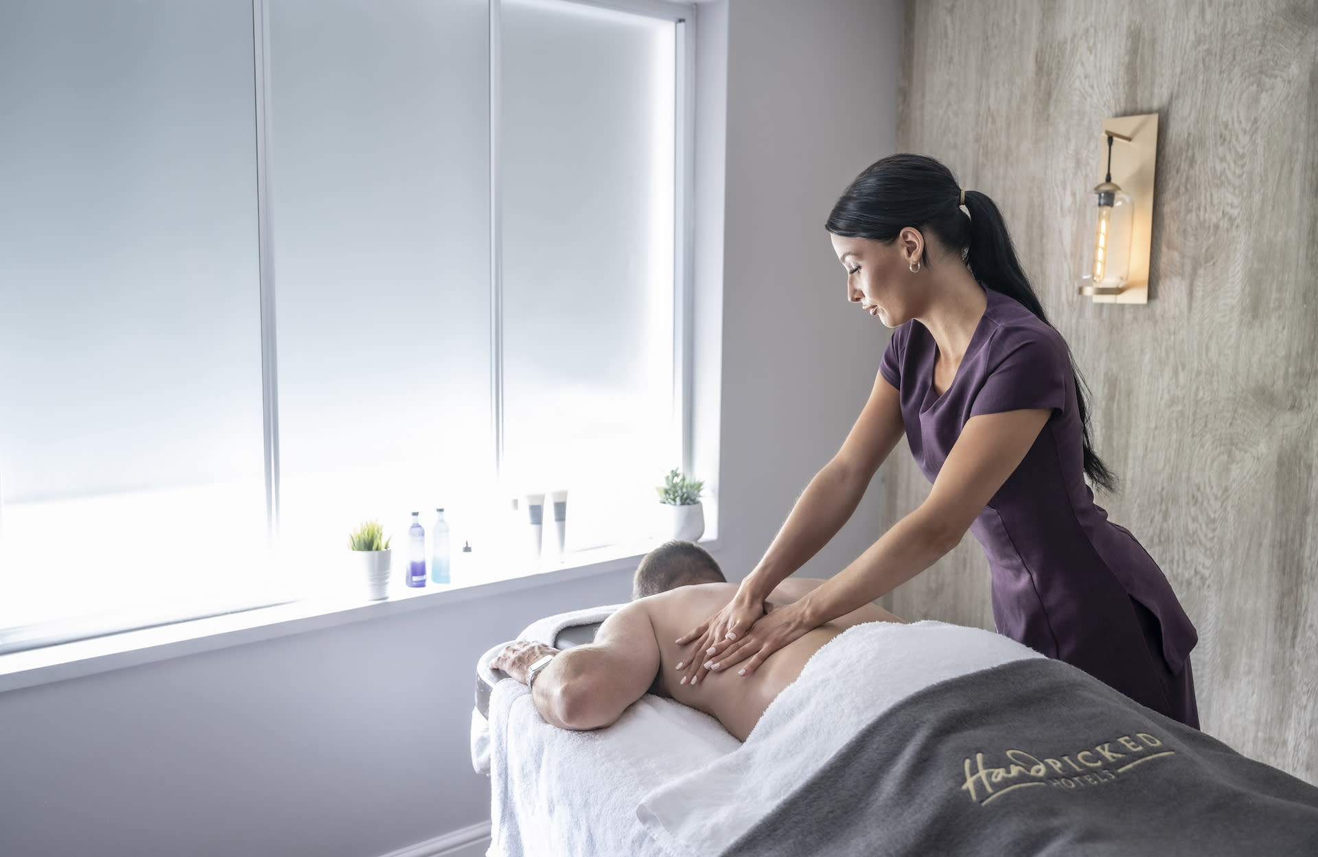 Best Spa Hotels UK Fawsley Hall Hotel & Spa man getting a massage
